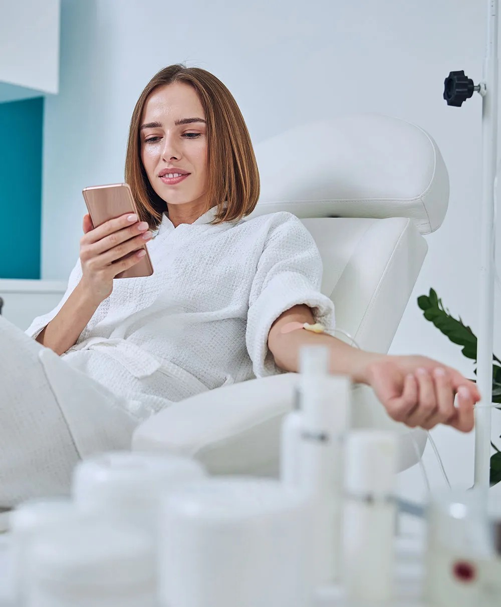 A girl getting IV drip Vitamin injection from Mykonos Medspa in Sherman Oaks
